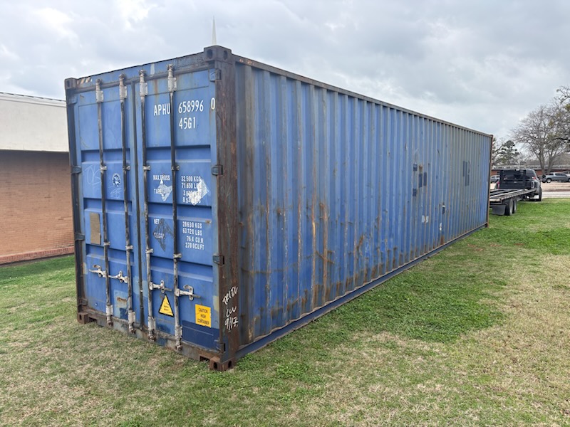 40 ft High-Cube Cargo Worthy container, exterior at delivery site, door end facing camera